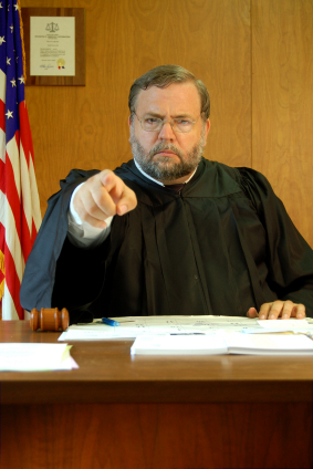 Angry judge pointing at you