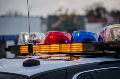 top of police vehicle with lights on